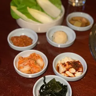 a variety of food in small bowls on a table