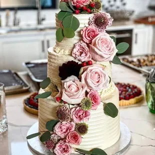 Top Tier: Cinnamon Mascarpone Fig Middle Tier: White Chocolate Pistachio Bottom Tier: Earl Grey Cake filled with Lemon Blueberry Curd