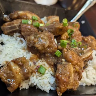 Pork ribs in black bean sauce over rice