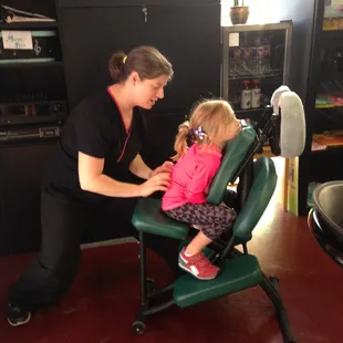 It's never to early to treat yourself well! MT, Teresa gives a chair massage to one smart kid!