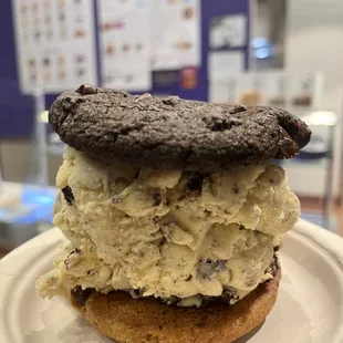 Cookies &amp; cream ice cream sandwiched between Double Chocolate Chunk Cookie and Chocolate Chunk Cookie.