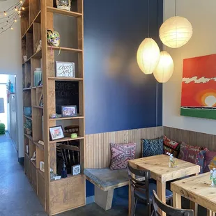 a dining area with a built in bookcase