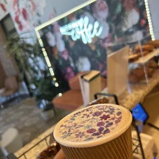 a person holding a cup of coffee