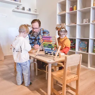 a man playing with children