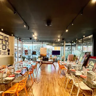 a long dining room with lots of tables and chairs