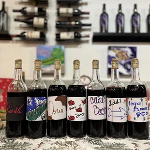 six bottles of wine on a table