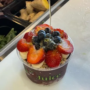 a yogurt with strawberries and blueberries