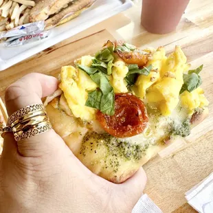 WAKEY BAKEY FLAT BREAD , love the Scrambled egg , pesto , spinach and very flavorful sun dried tomatoes on this Flatbread .