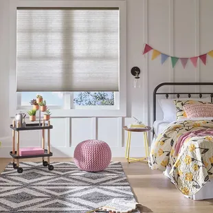 Cordless motorized Applause® Honeycomb Shades are easy to operate and child and pet-safe. Perfect for bedrooms.