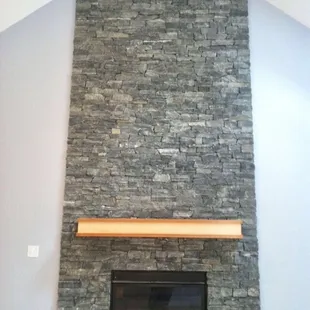 Natural stone fireplace and new mantel