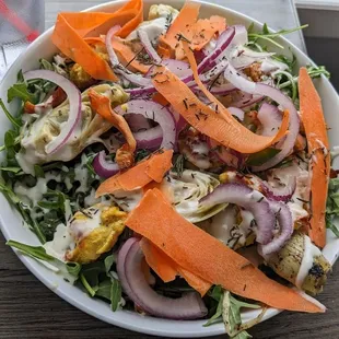 Mediterranean bowl with sweet potatoes and added turmeric chicken