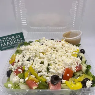 a salad in a plastic container