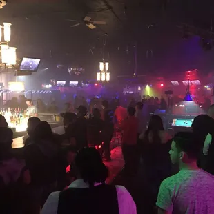 a crowd of people at a bar
