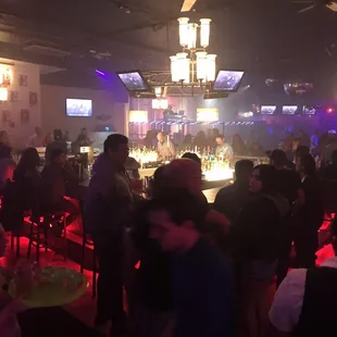 a crowd of people at a bar