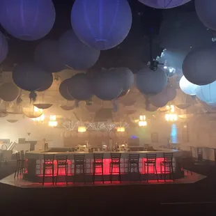 tables and chairs in a dimly lit room