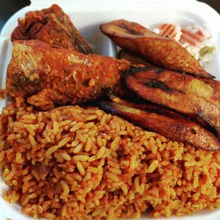 Jollof Rice steamed rice cooked in a tomato sauce with a unique blend, of spices serve with fried plantains and fish.