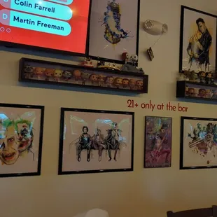 a wall full of artwork