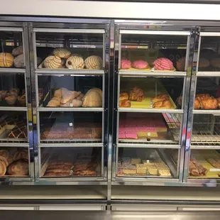  a display case full of baked goods