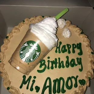  a birthday cake with a starbucks drink