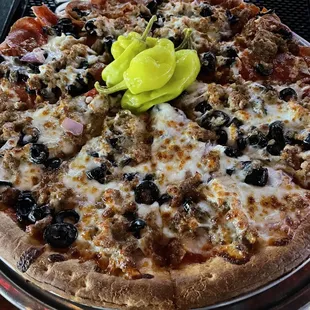 a pizza with pickles on top