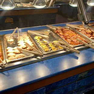 a variety of food items in a buffet