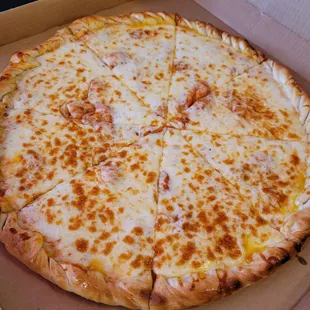Beautiful full pie of cheese pizza. Take a look at that nice knotted crust and ooey gooey cheese.