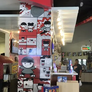 a little girl sitting at a table