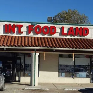 The Entrance in a strip center on the east side of the street.