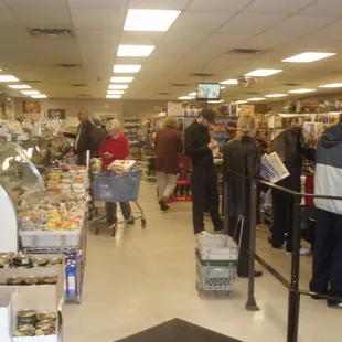 people shopping in a grocery store