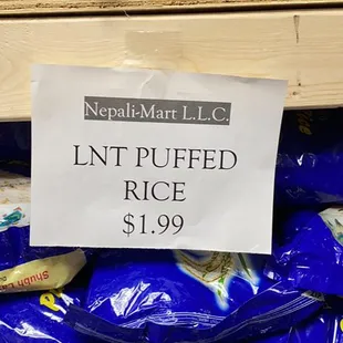 a sign on a pile of rice