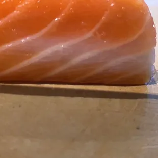 Atlantic salmon .. This is damaged salmon they send to customers. The white part the salmon got cancer . That's why color changed a white