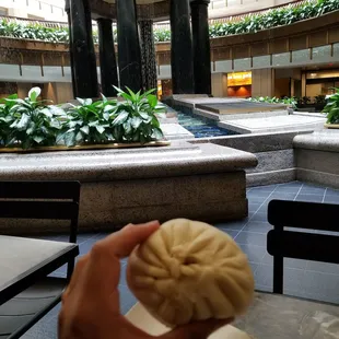 a person holding a doughnut