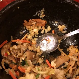 a pan of food with a spoon in it
