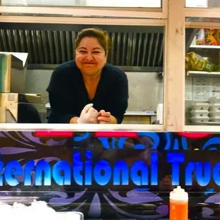 a woman behind the counter