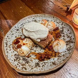 Brown butter cake with cinnamon gelato, brown sugar and butter sauce, pecans, and brûléed meringue