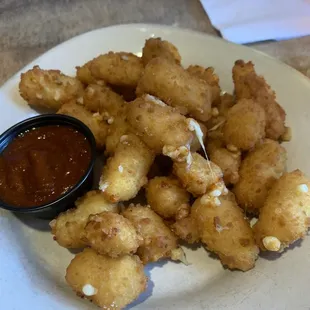 FRIED CHEESE CURDS, served with ancho sauce