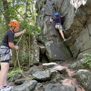 Climbing along summit rock trail