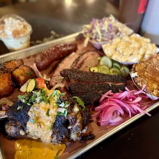 Tray'O meat.  Closes to you is the pork shank topped with coconut curry.