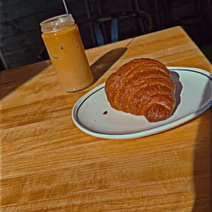 Iced coffee and buttery flaky croissant