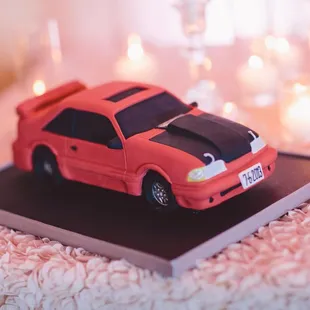 Groom&apos;s cake of his self-built race car. Perfect attention to detail based off of photos sent to Kelly. Modern Love Photography.