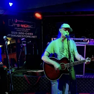 a man playing a guitar