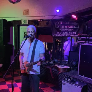 a man playing a guitar