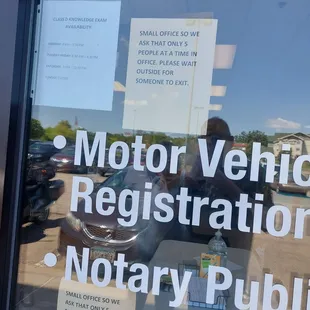 The line is outside. The office is small.