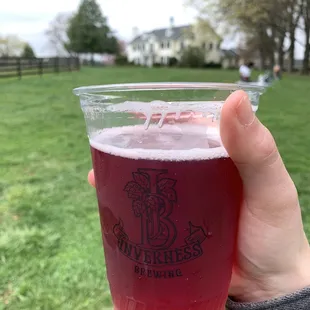 Blueberry Sour with upscale farm home on premise in background