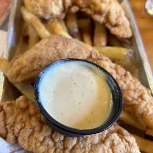 a tray of fried fish and fries