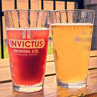 two glasses of beer on a table