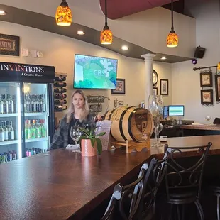 a woman behind the bar