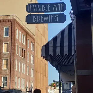 a crowd of people walking down the street