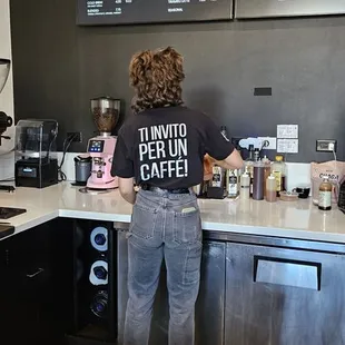 a woman standing at the counter