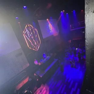 a stage with purple and blue lights